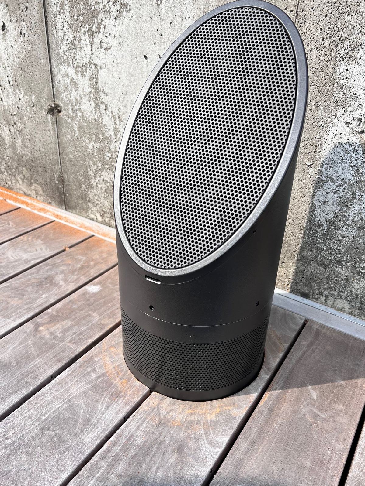 Outdoor bollard speaker on a wood deck